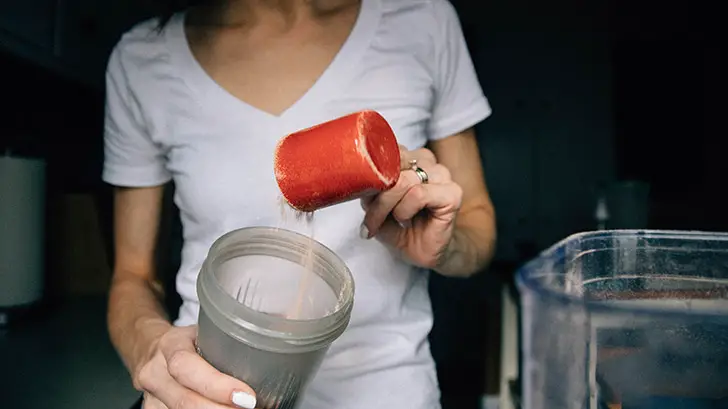Woman making a Protein Shake