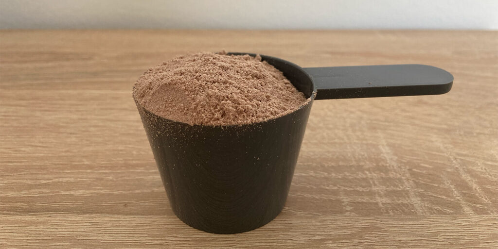 Scoop of Myprotein Impact Whey Protein Natural Chocolate Flavour